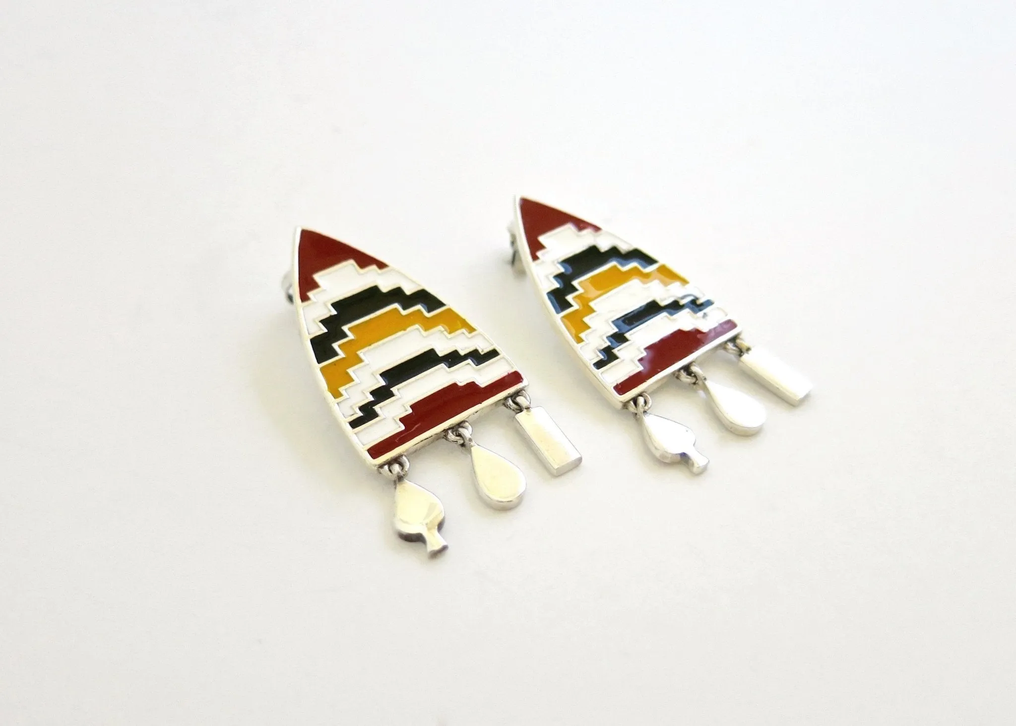 AMARE shield earrings with enamel work and fringe