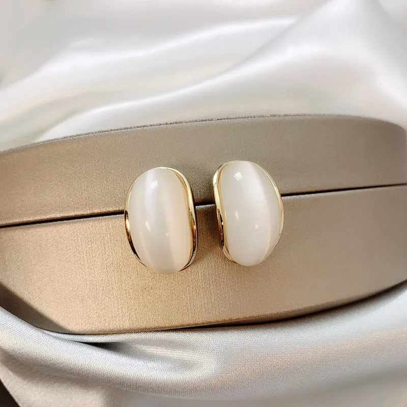 Simple hundred-touch cat-eye stone arc 925 ear pin