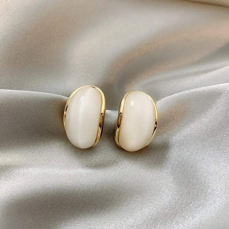 Simple hundred-touch cat-eye stone arc 925 ear pin